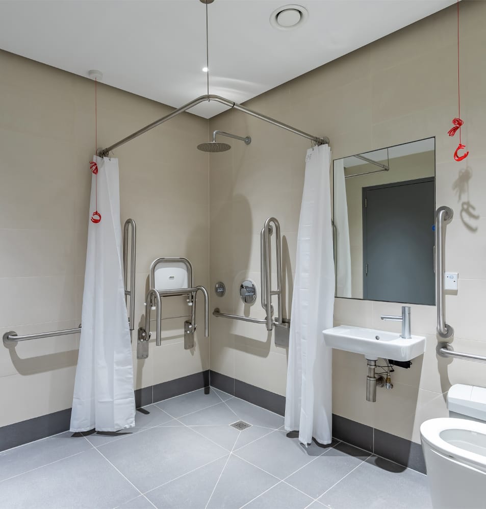 Accessible washroom using thermostatic mixing valve on shower and tap