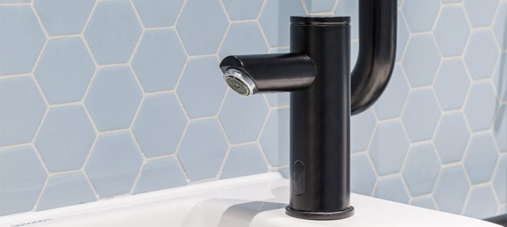 Cleaning polyester powder coated commercial tap