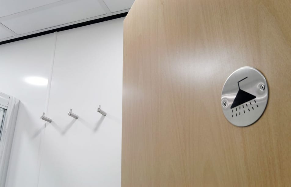 Commercial shower room with three clothes hooks