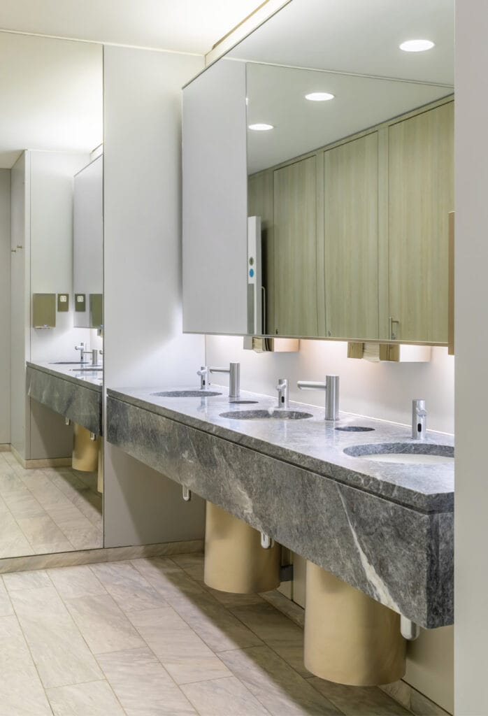 Touch-free taps, soap dispensers, hand dryers in a commercial washroom