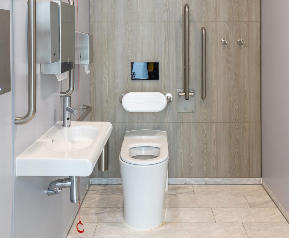 Doc M commercial washroom with floor mounted toilet pan