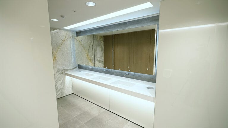 Commercial washroom design using Alavo Unico Vanity and sensor taps