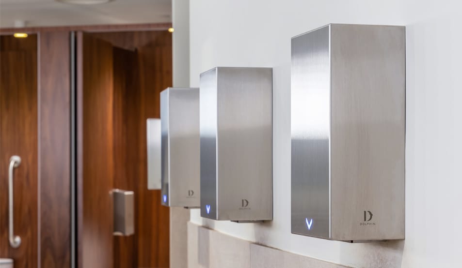 Row of satin finish stainless steel commercial hand dryers with HEPA filter
