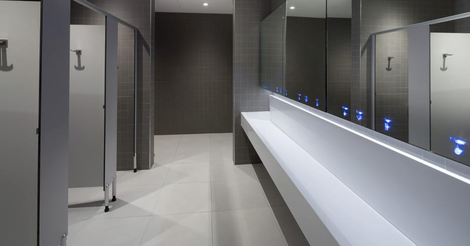 Washroom space saving behind mirror system and floating vanity wash trough