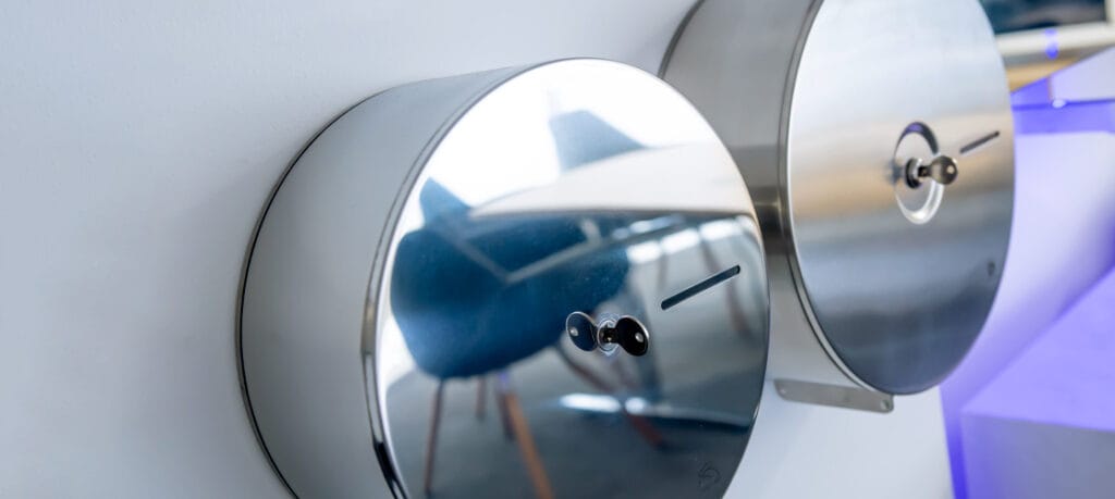 Mirror polish compared to satin finish stainless steel mini jumbo roll dispensers