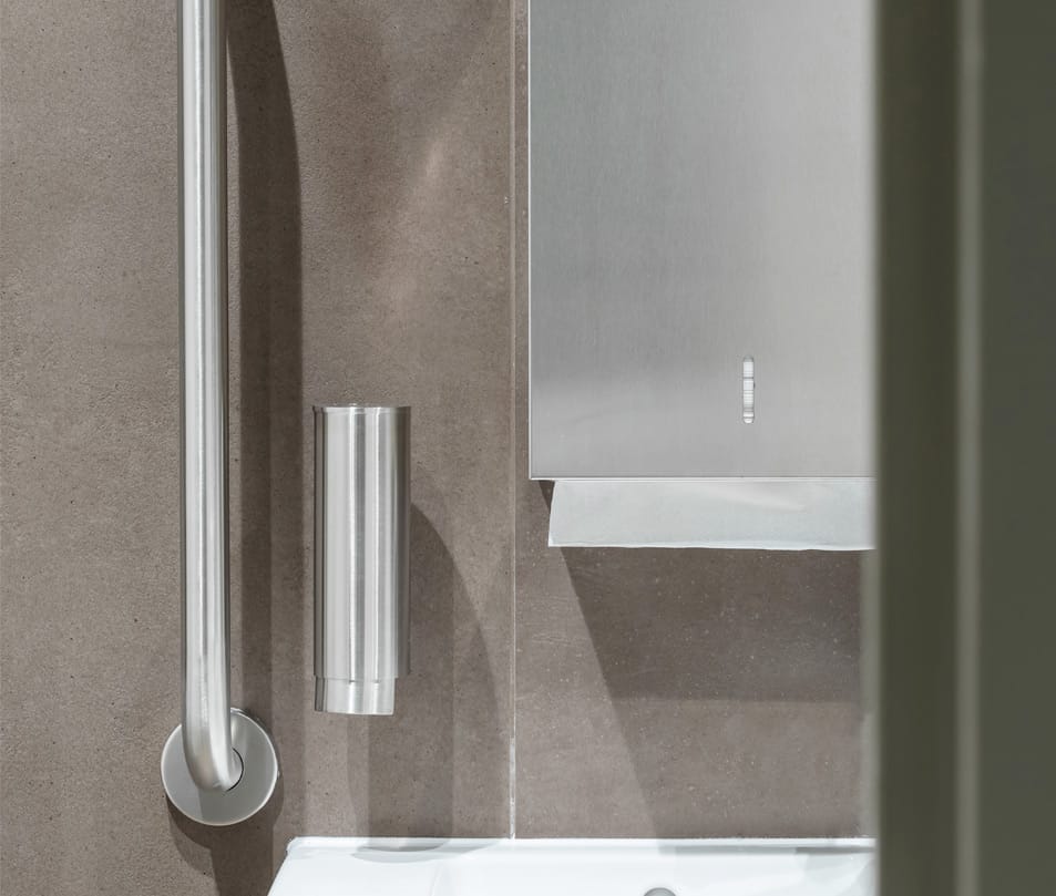 Grab rail, soap dispenser, and paper towel dispenser in satin stainless steel finish