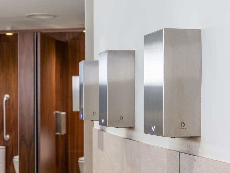 Row of satin brushed hand dryers with HEPA filter