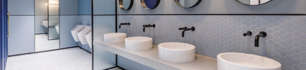 Black taps and soap dispensers using Dolphin Solutions Strataplate