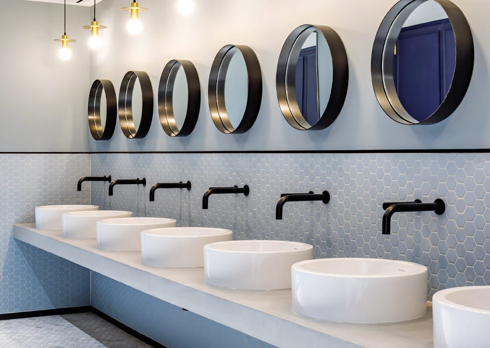 Black specialty coating on commercial washroom touch-free taps and soap dispensers