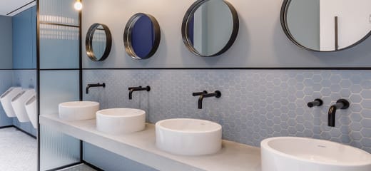 Black taps and soap dispensers with wall mount fixing kit