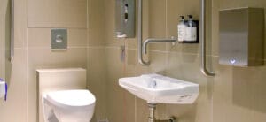 Accessible hand dryer in a wheelchair toilet