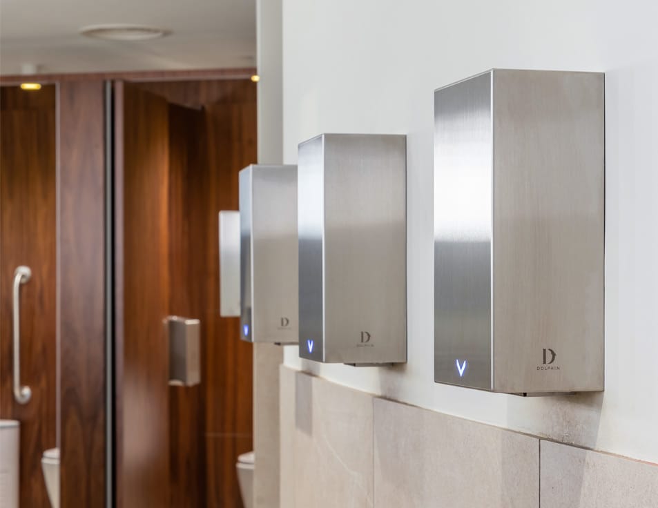 A row of hand dryers with HEPA filter in a commercial washroom