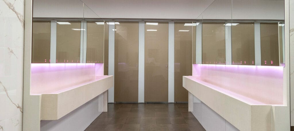 End-of-trip facility with an instant hot water system integrated into the ALAVO