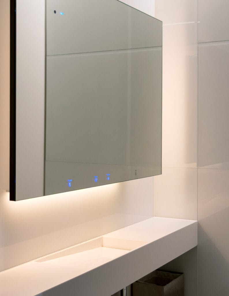 Single use superloo layout installed with a behind mirror instant hot water system