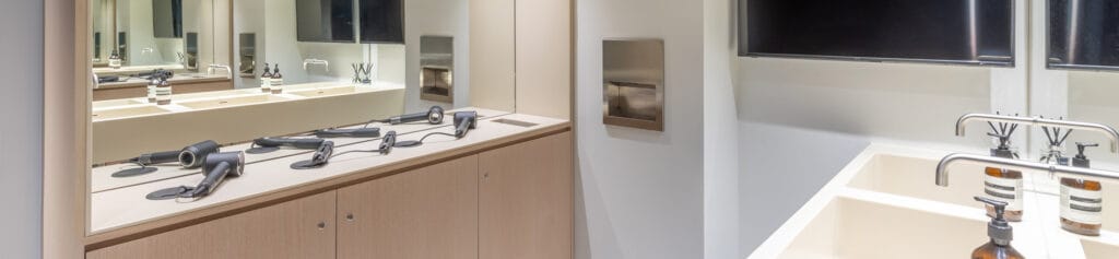 Allocated space for hair dryers in a set-down vanity area