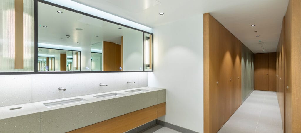 A commercial washroom designed with SMART technology and sustainable solutions such as sensor taps and foaming soap