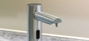 Counter mounted sensor soap dispenser