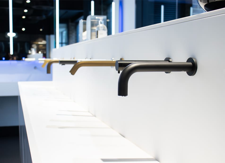 Row of SMART taps and soap dispensers at Dolphin Design Hub