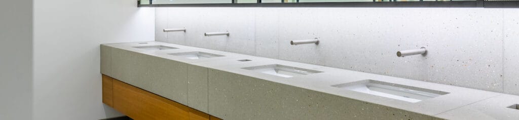 Row of commercial taps using wall plates