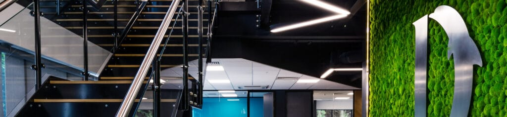 Dolphin Logo in moss wall at the head office