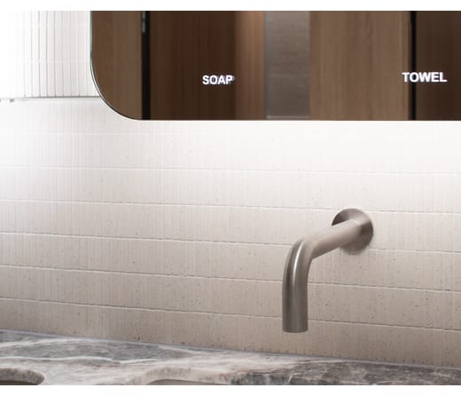 Behind mirror soap dispenser installed on an Alavo Solo