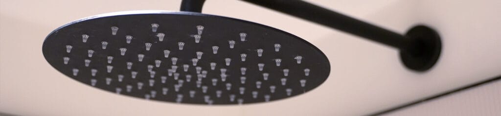 Black shower head with KIWA certification for commercial washrooms