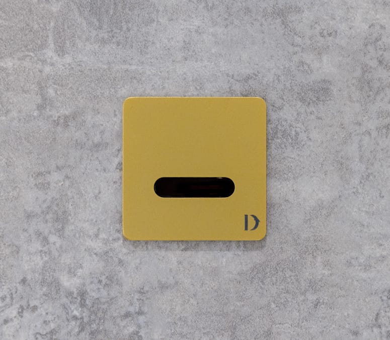 Special finished mini electronic flush plate at the 6 New Street Square Washroom Project by Dolphin Solutions