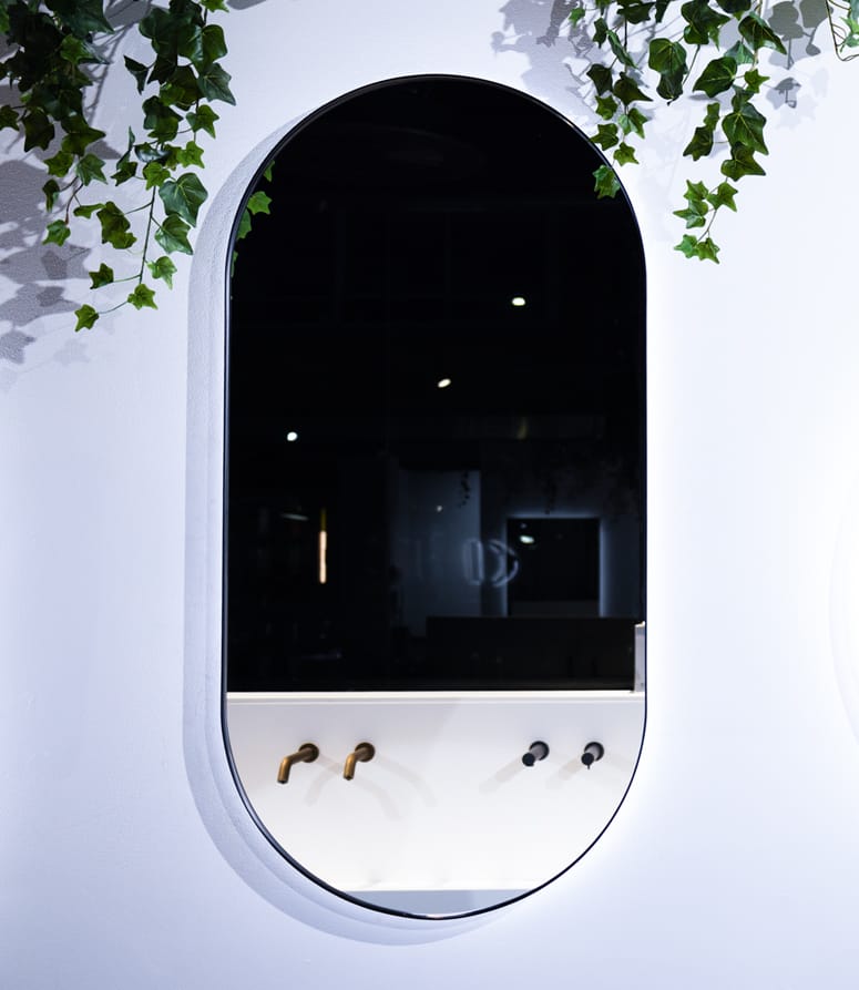 Pill-shaped mirror exhibited at the Dolphin Solutions showroom
