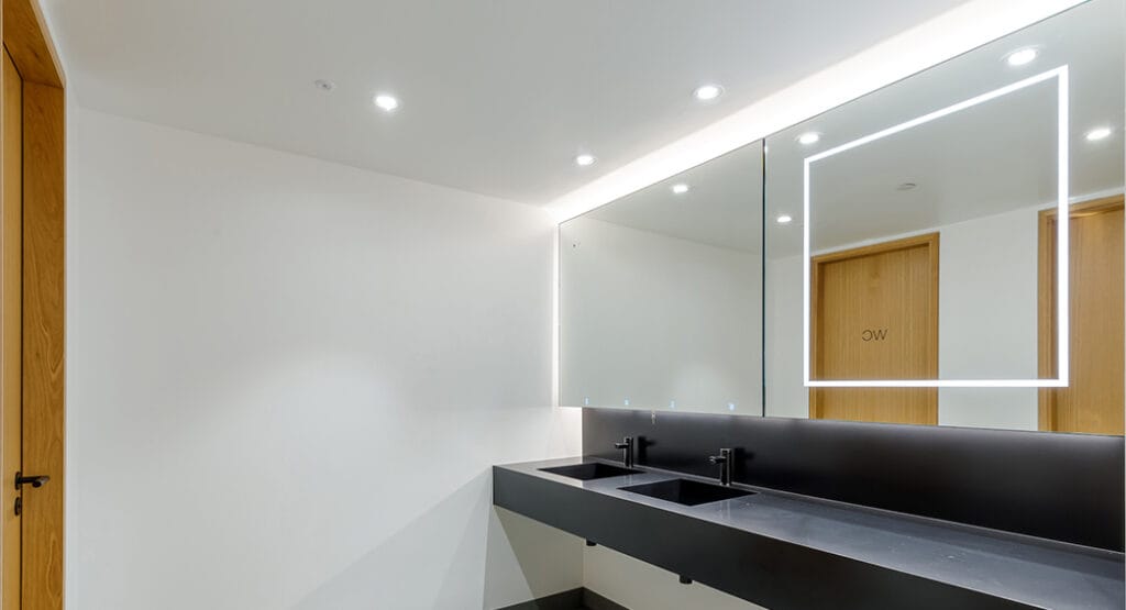 LED lit washroom mirrors with Alavo behind mirror by Dolphin Solutions at the MET building