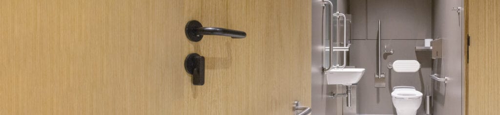 Black toilet door handle and lock for disabled washrooms