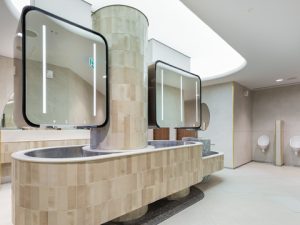 Alavo mirror system and urinals in male washroom