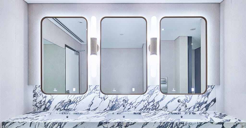 Illuminated icons for behind mirror soap dispensers and paper towel dispensers.