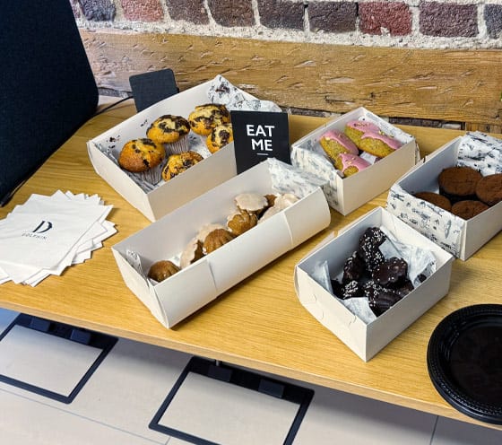 A table of baked goods and treats at Dolphin pop-up event