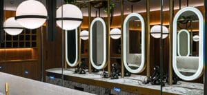 An informative blog by Dolphin Solutions about commercial framed mirrors versus frameless mirrors