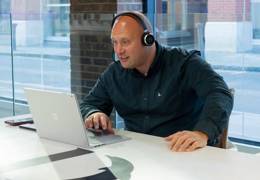 Dolphin Solutions commercial restroom consultant on call with a client