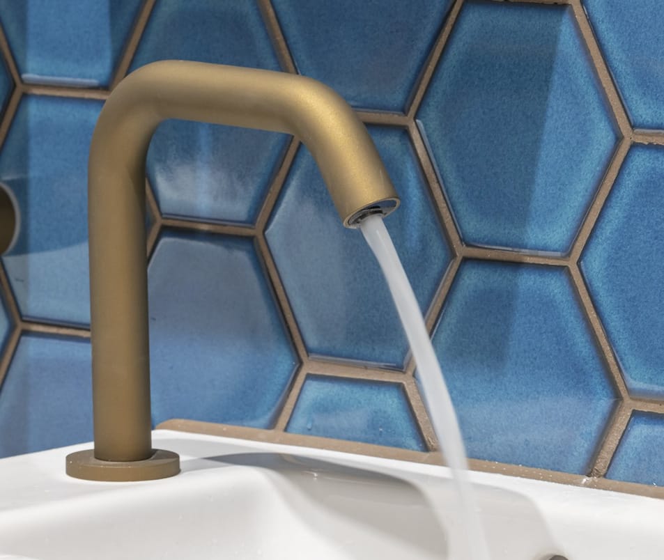 Ceramic coated faucet with running water